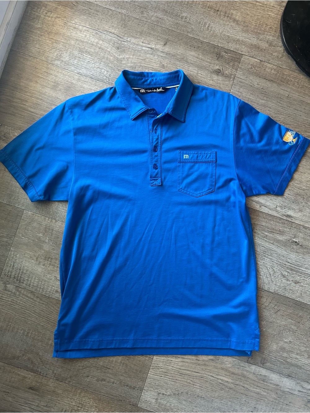 Travis Mathew Men’s Royal Blue Polo Shirt with President’s Cup Embroidery
